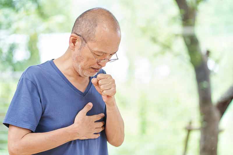 Man coughing with painful lungs