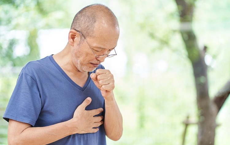 Man coughing with painful lungs