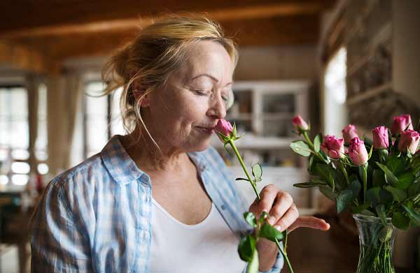 Woman smelling rose