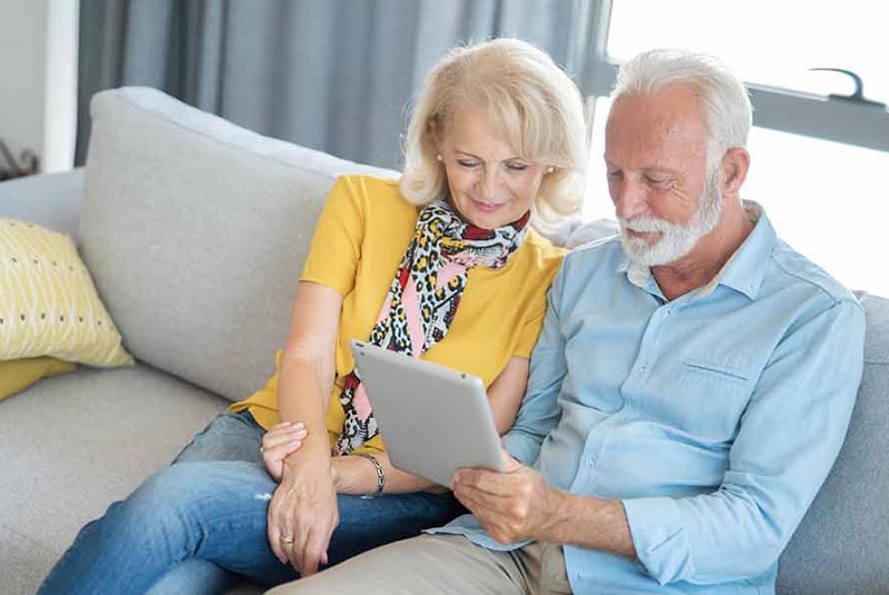 A couple looking at an ipad