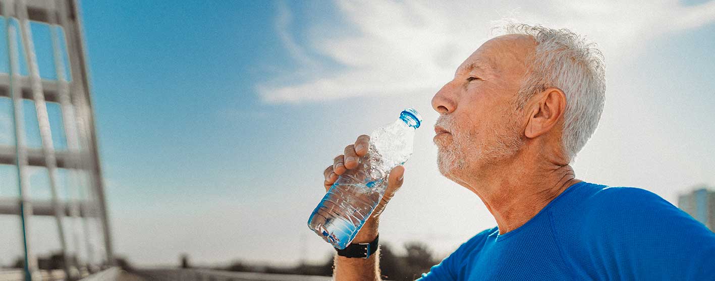 Man drinking a bottle of water
