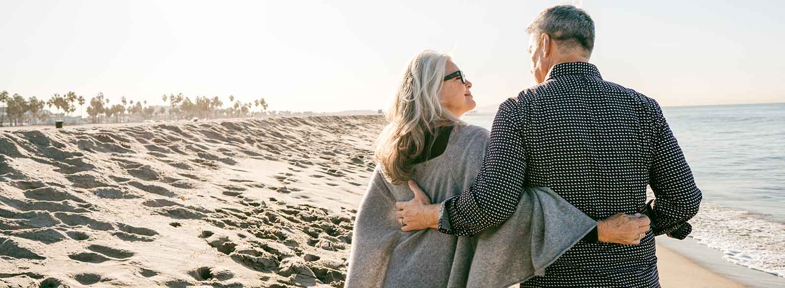 Couple walking down the beach