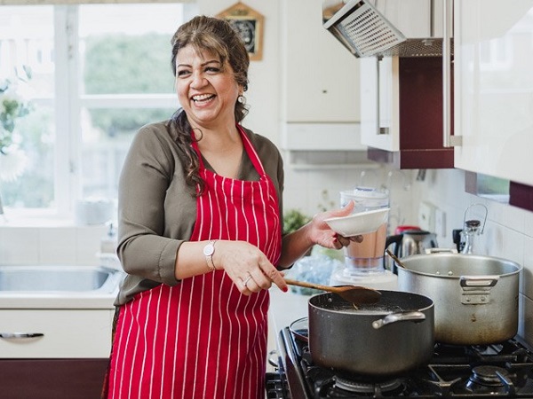 A woman cooking in the kitchen
