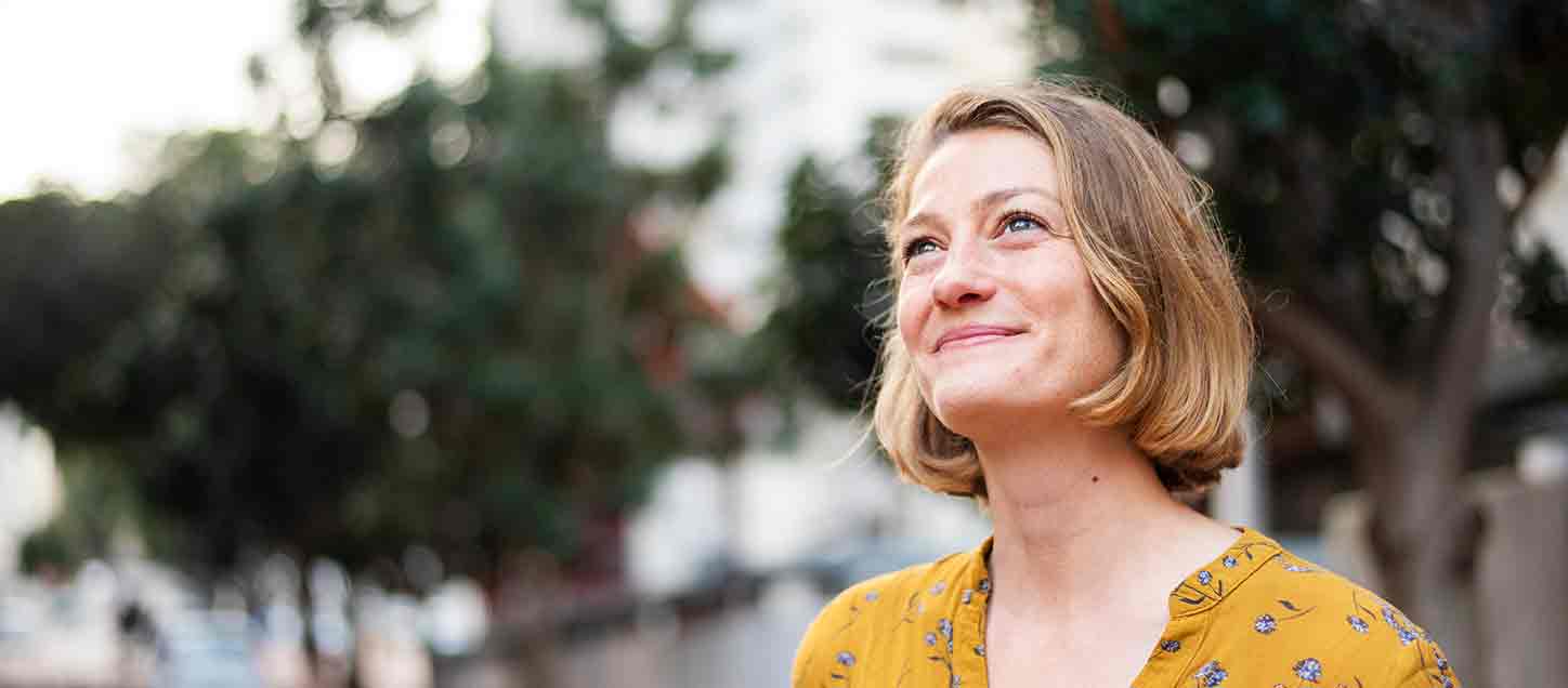 Woman looking up to the sky