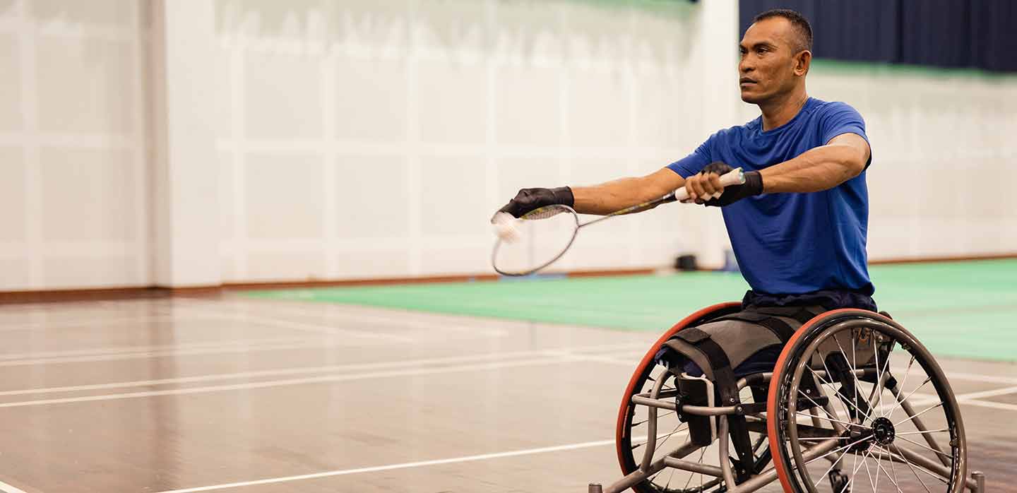 Para athlete playing badminton