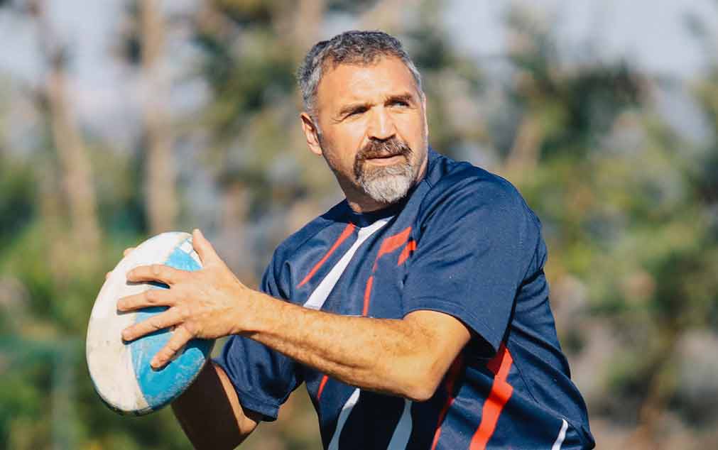 Man holding rugby ball