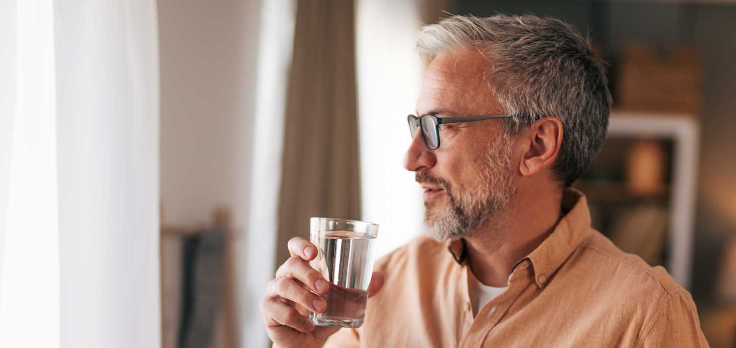 Man drinking a glass of water