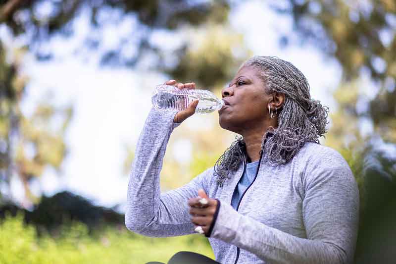 Older lady drinking water