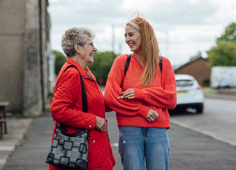 A young woman talking with her granny