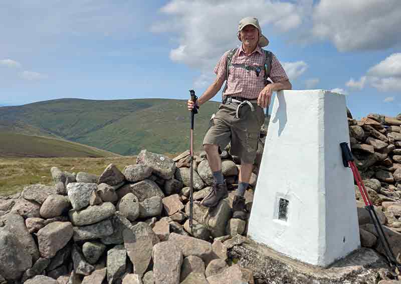 Mike Cable by a trig point