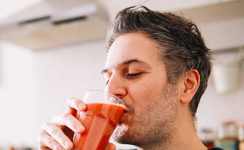 Man drinking healthy juice