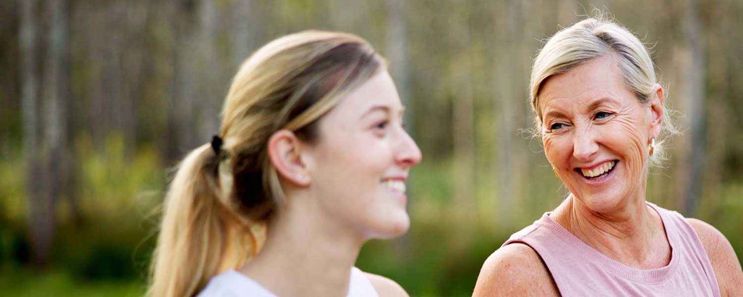 Two ladies drinking tea and laughing