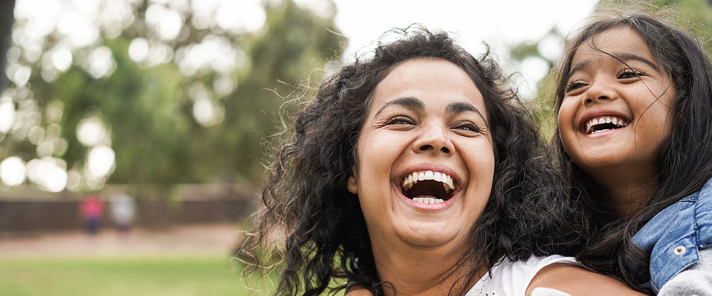 Mother and daughter laughing