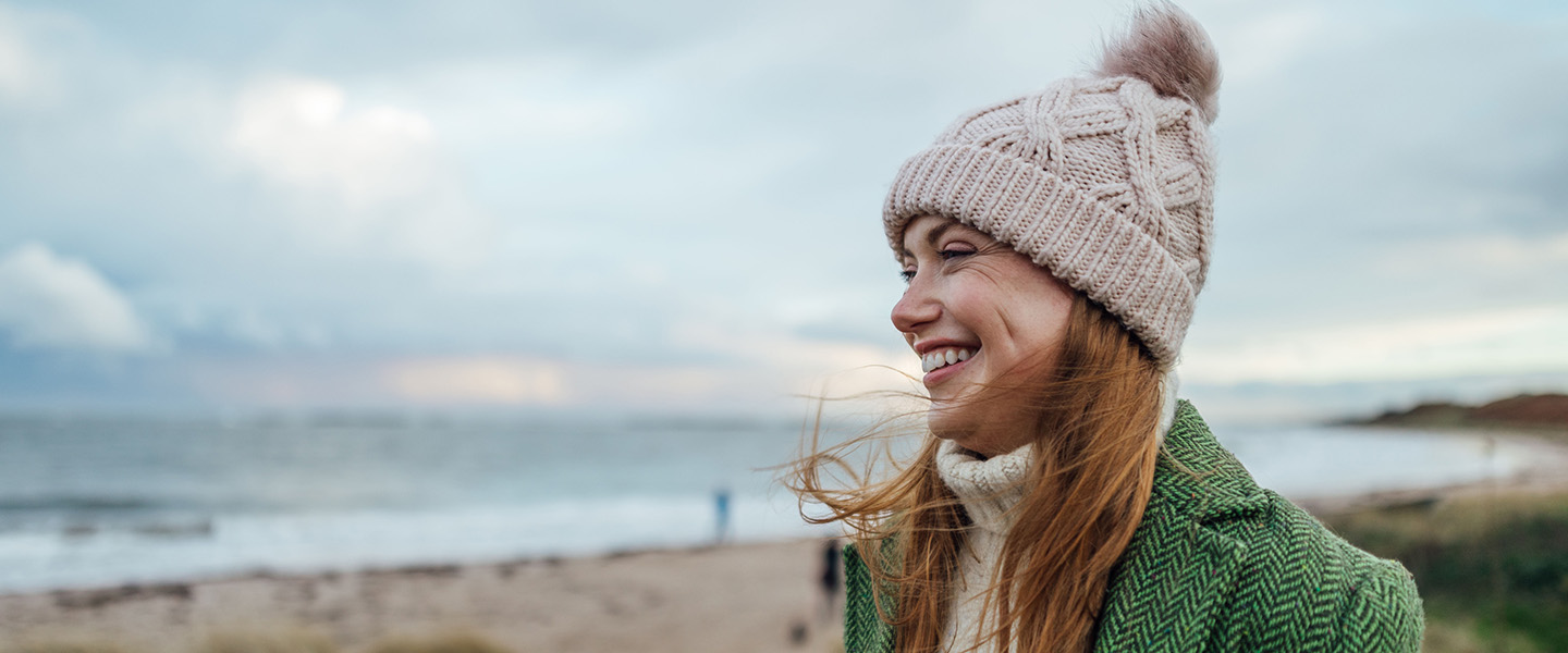 Smiling woman on a beach