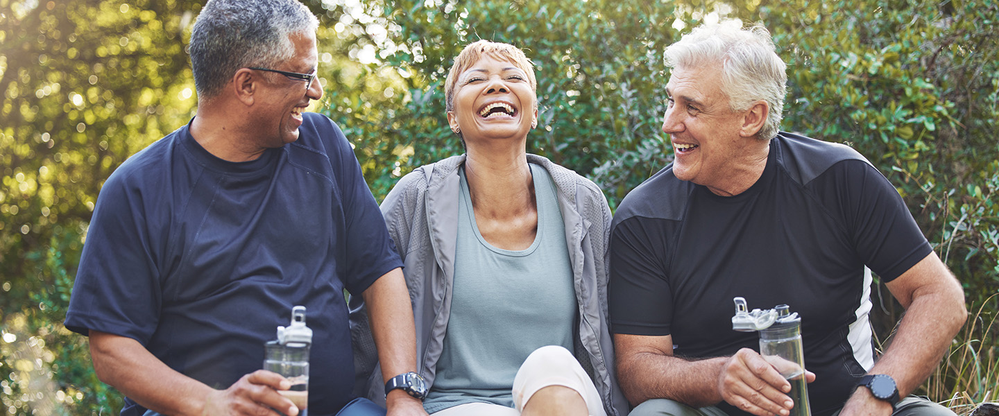 Three friends chatting in a forest
