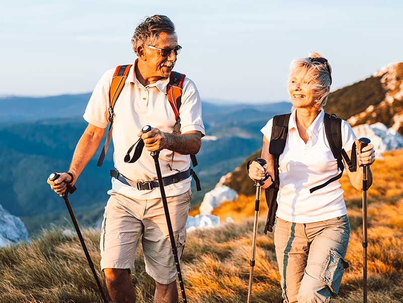 Two people hiking on the coast
