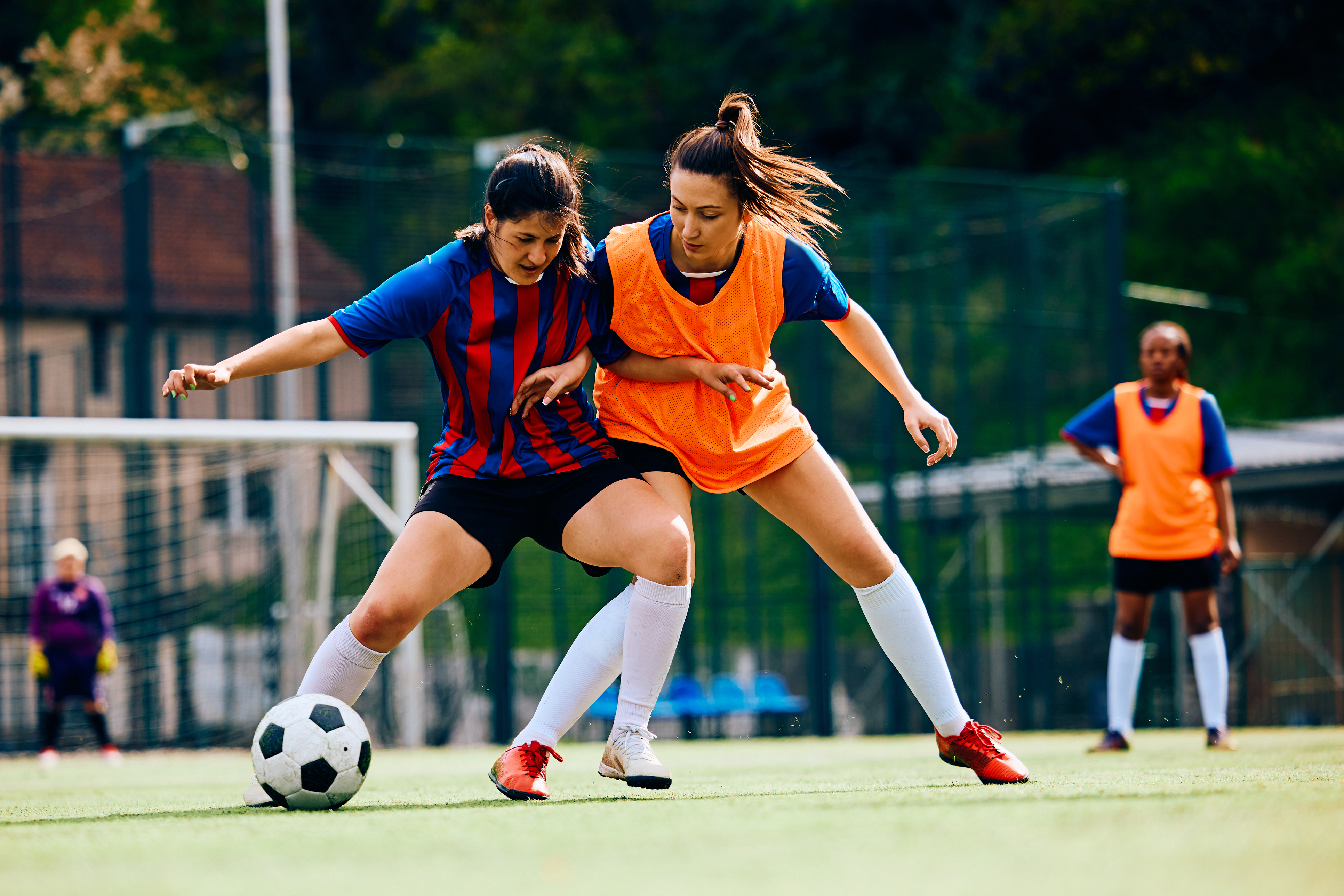 Two women playing football