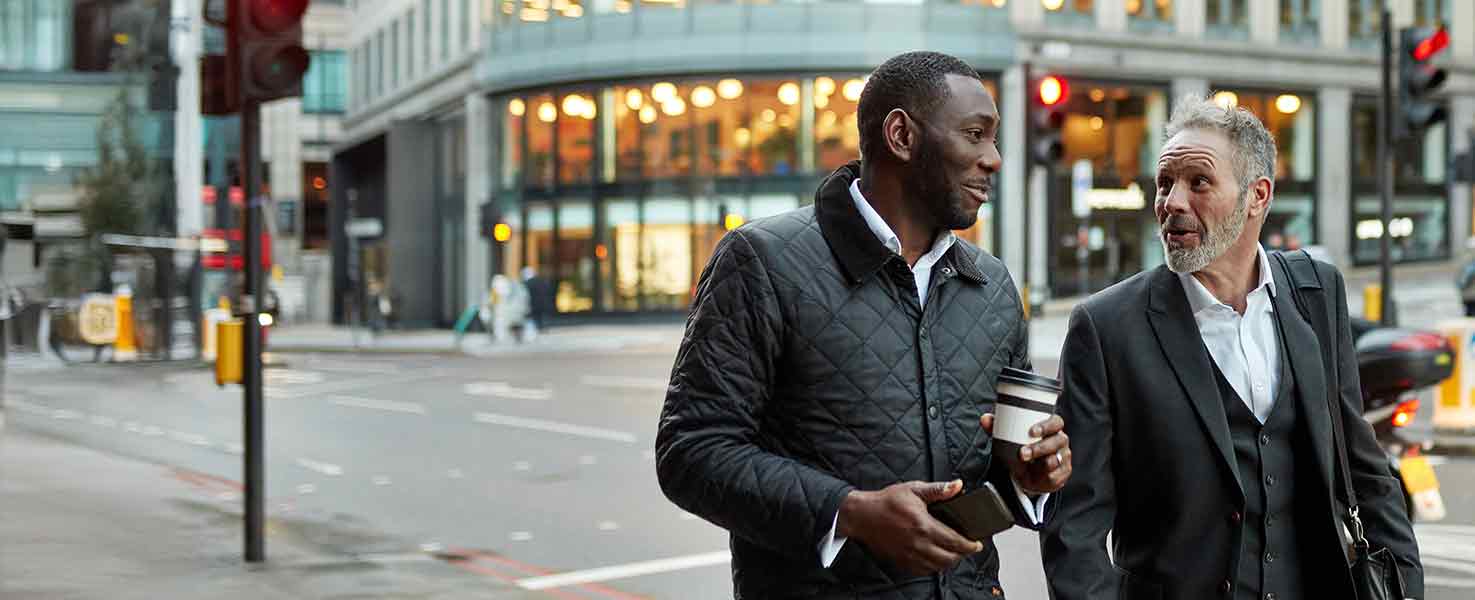 Two men walking in central London