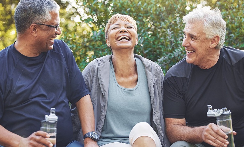 Three people laughing and joking