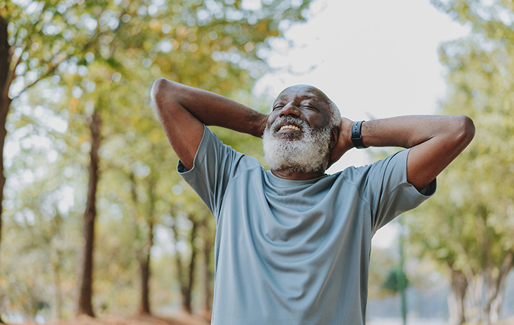 Man smiling in the woods