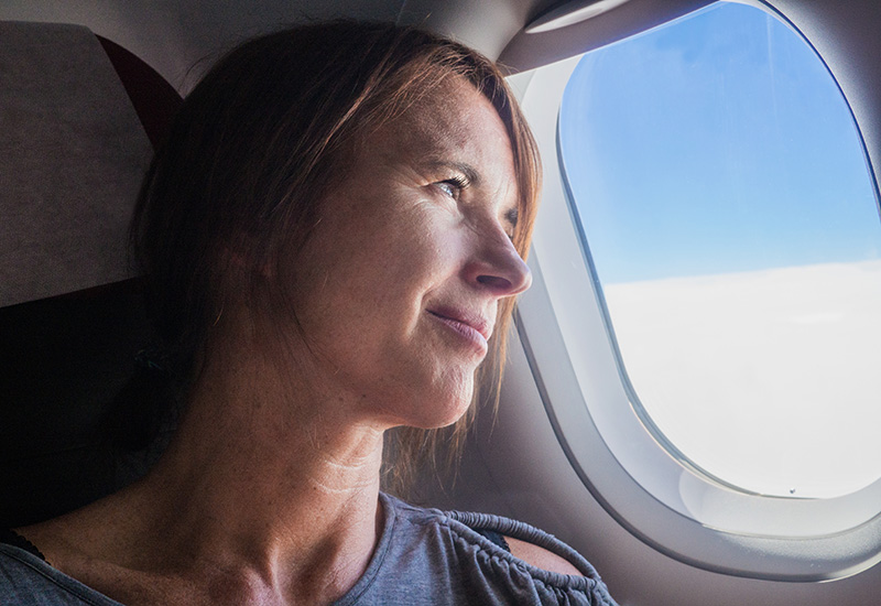 Middle aged woman on an aeroplane