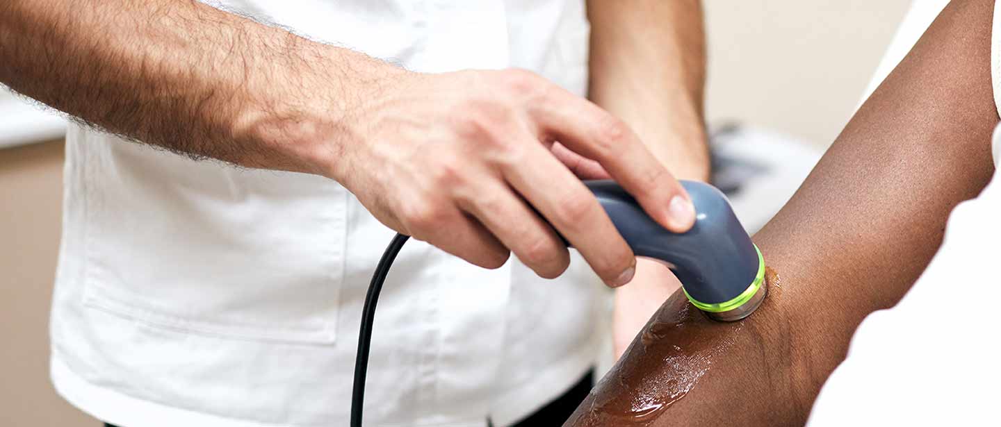 A clinician carrying out an ultrasound