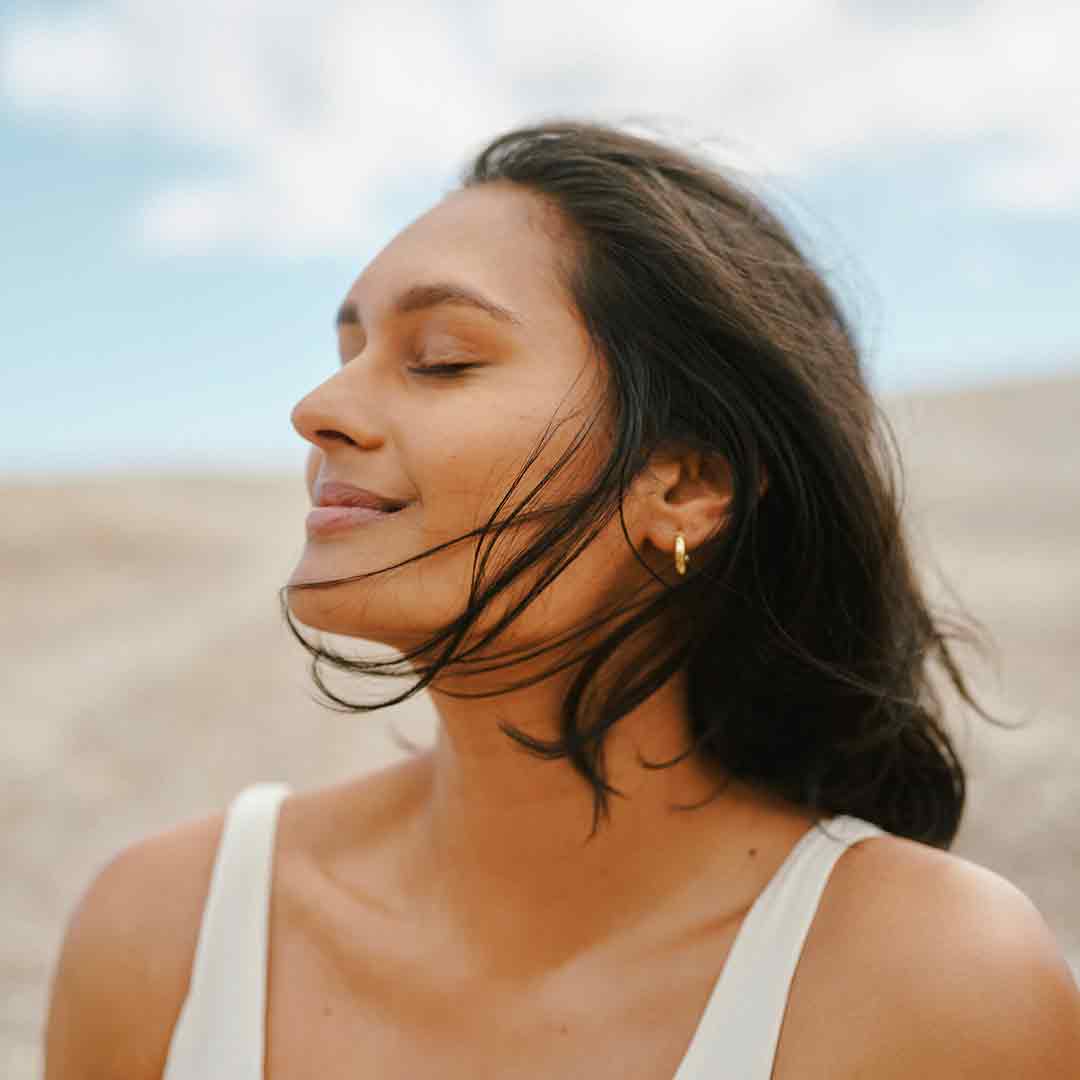 Woman taking a deep breath
