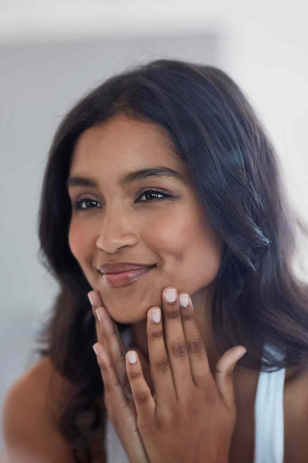 A woman looking in the mirror