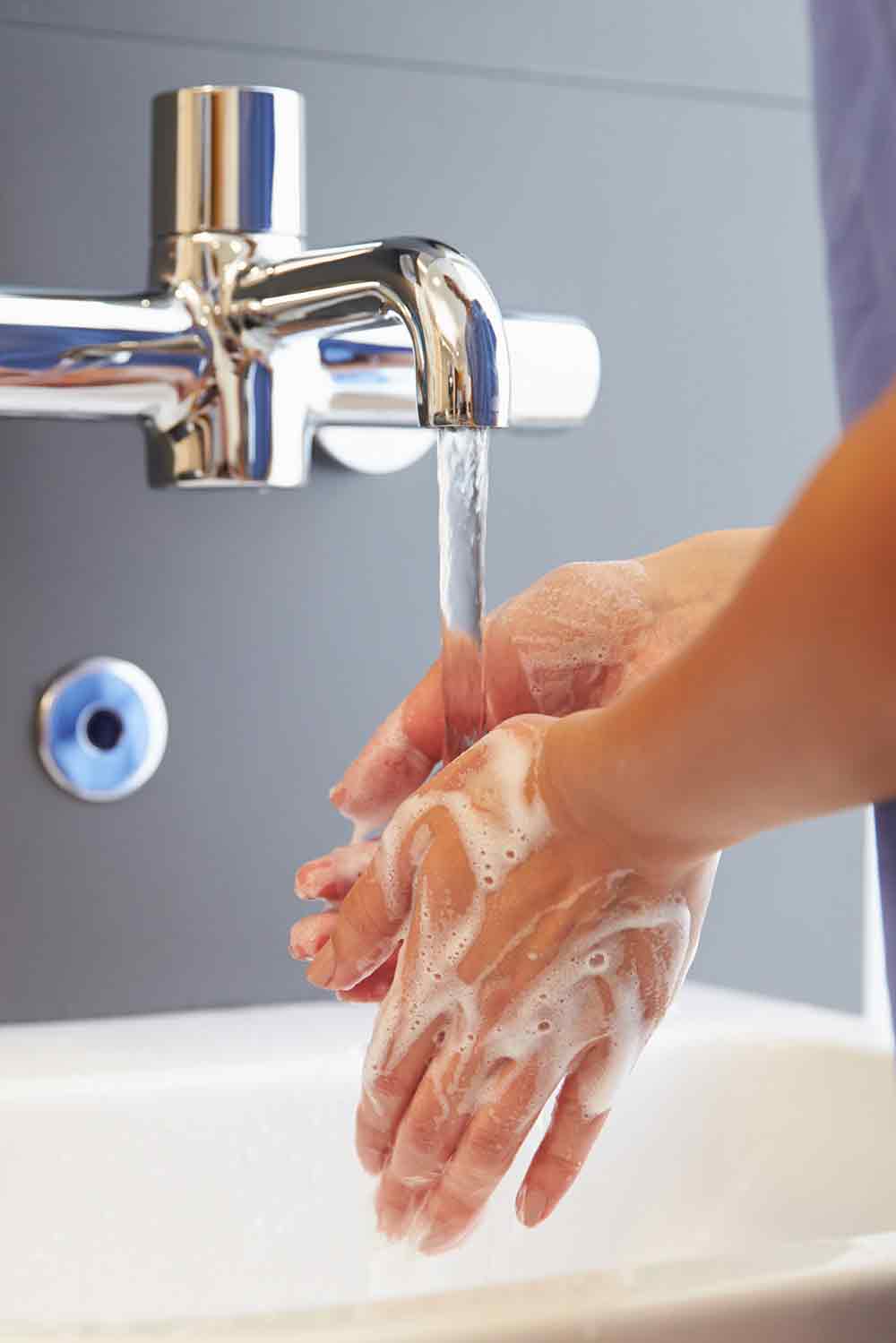 A clinician washing their hands
