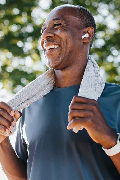 A man laughing after exercise