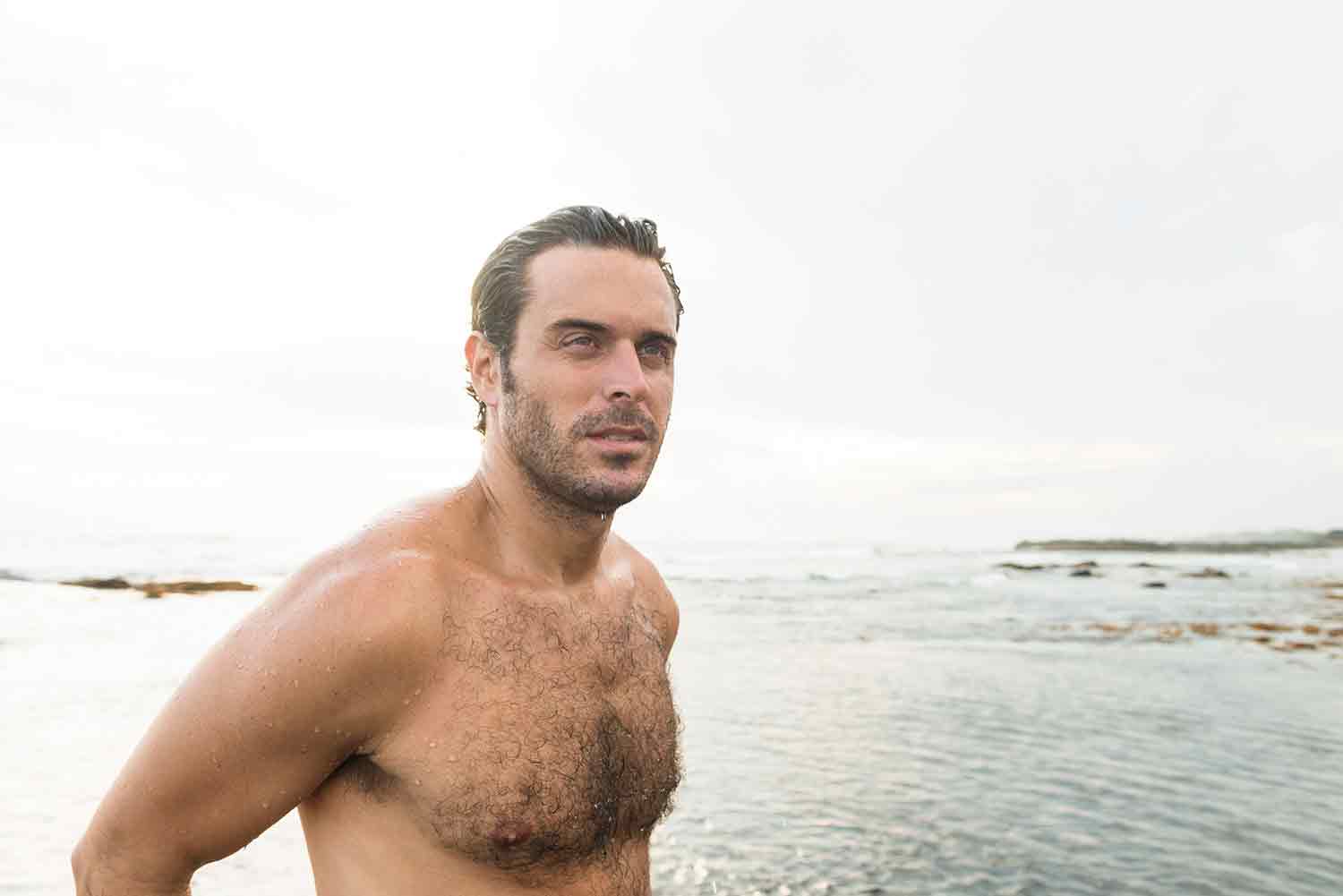 A man emerging from the sea