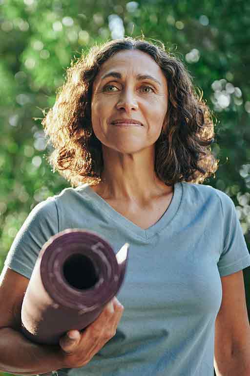 A woman with her yoga mat
