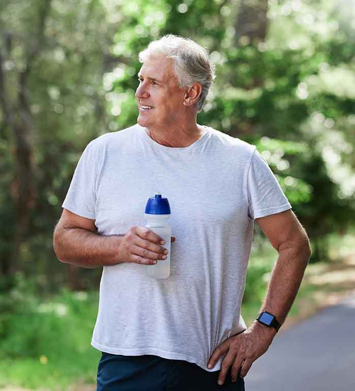 An older man having a break from his walk