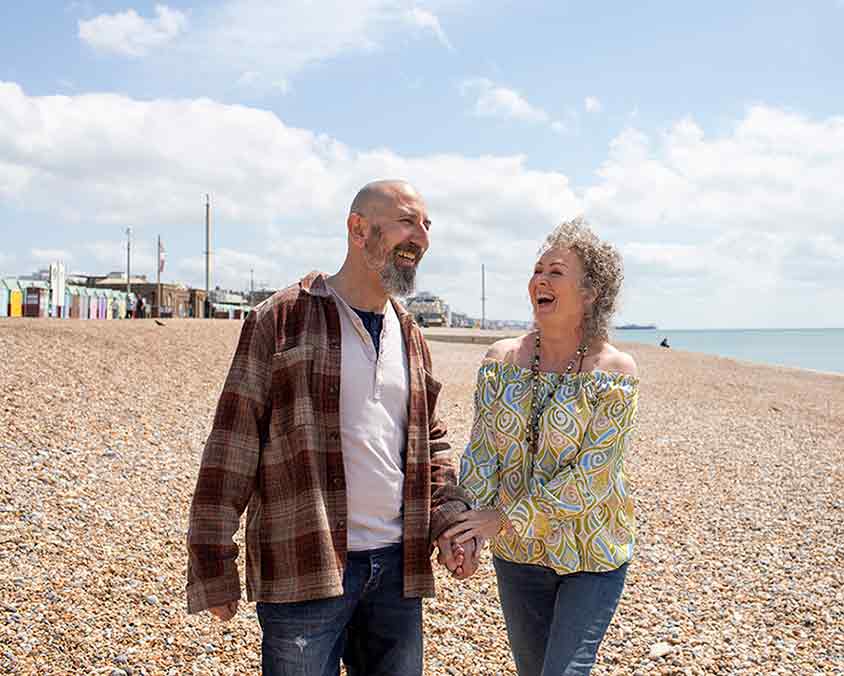 A couple walking on the beach