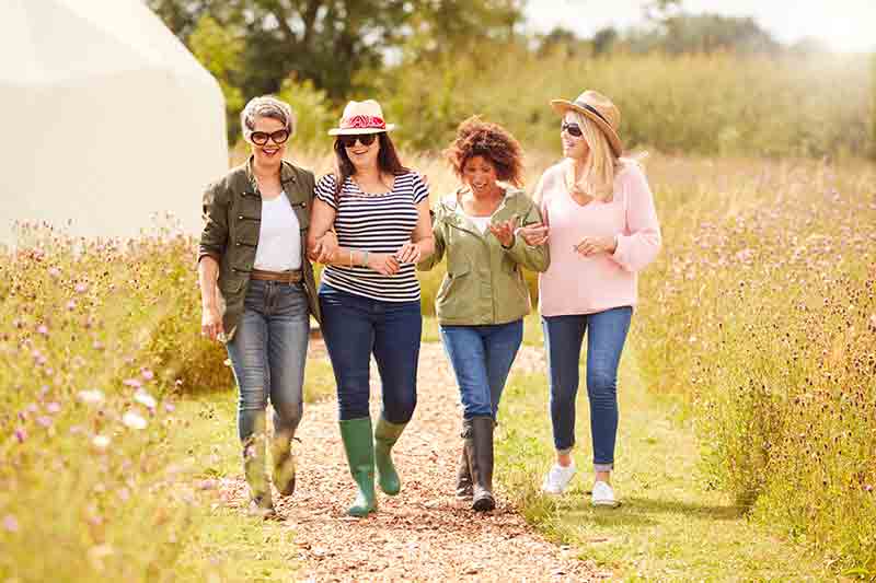 Group of female friends walking in the country