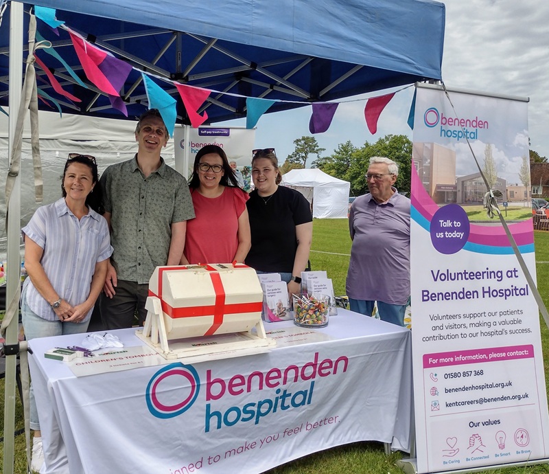 A group of people on a stall at a fete