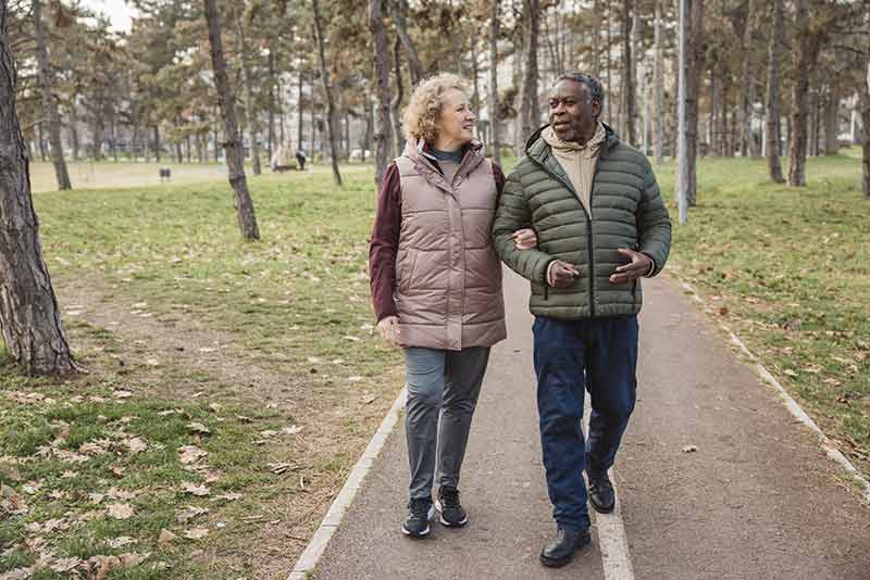 A couple walking in the woods