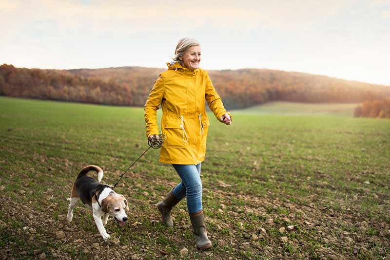 A woman walking her dog