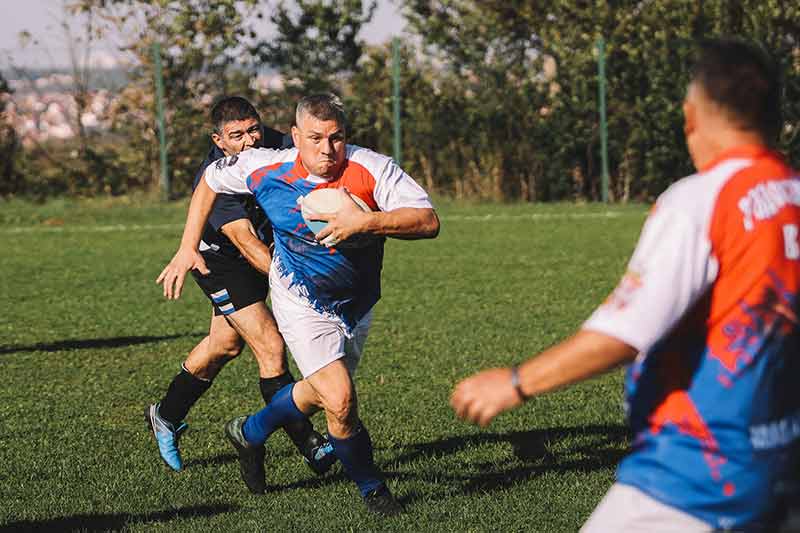 A group of men playing rugby