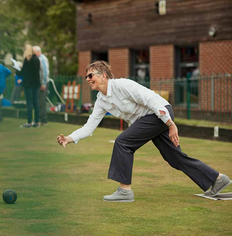 A woman on a bowling green