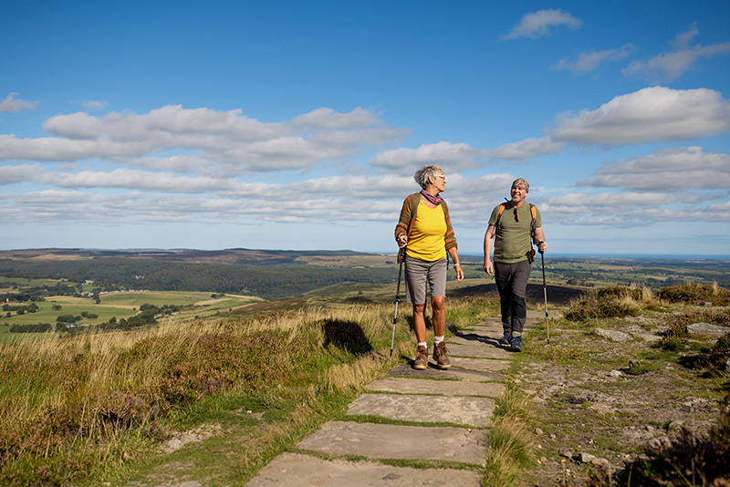 Mature man and woman hiking in the countryside