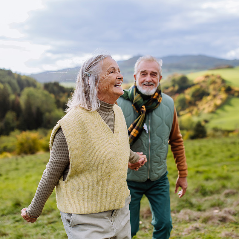 Senior couple walking in the countryside