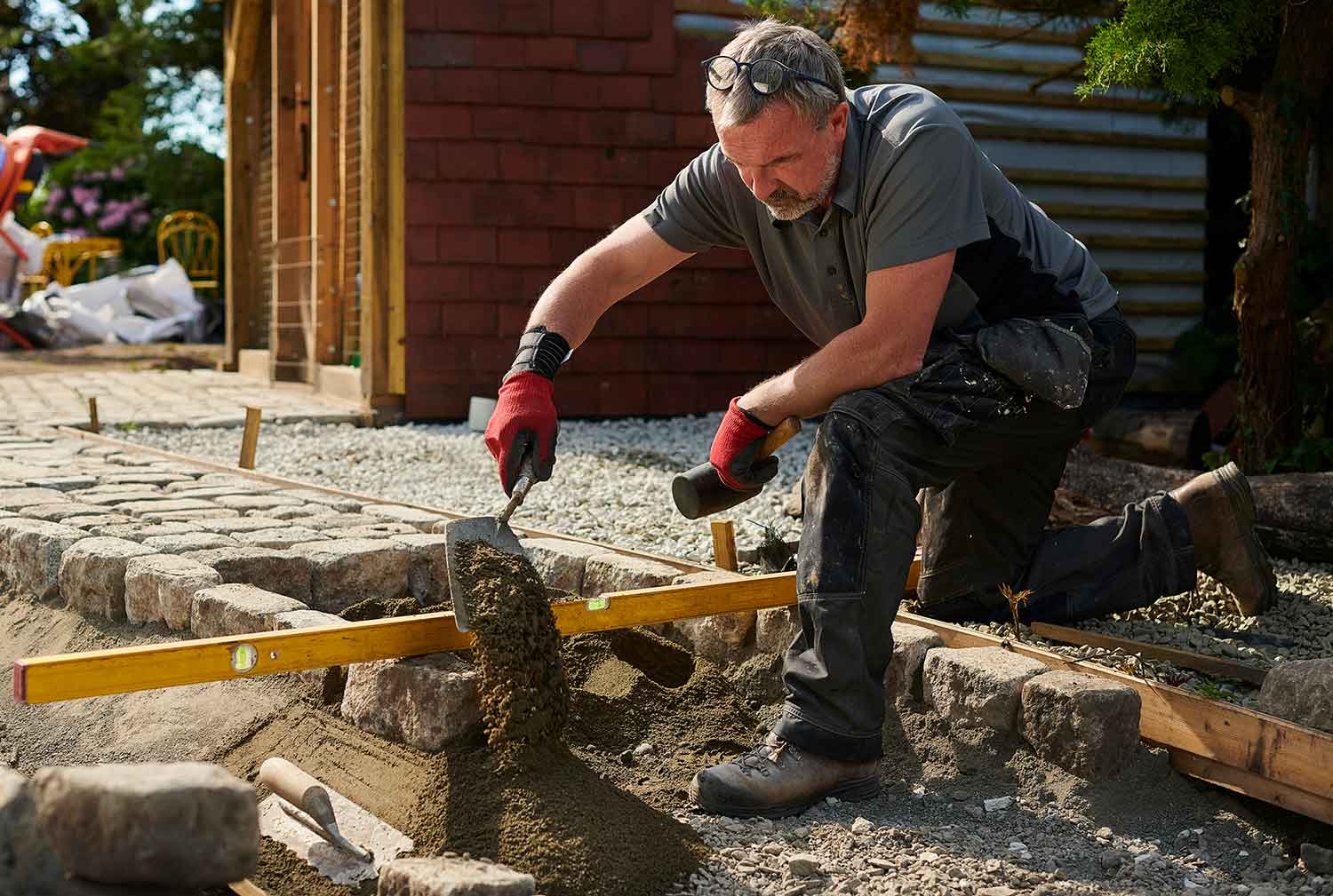 A man kneeling down at work