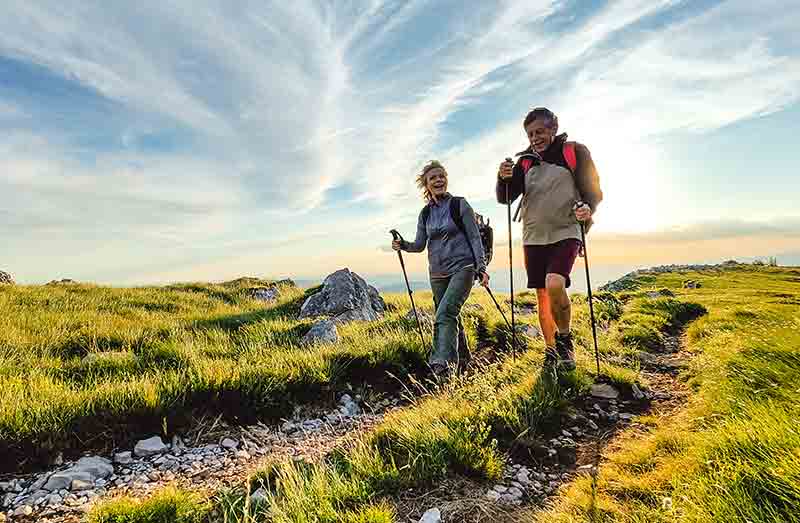 Two people walking in the countryside