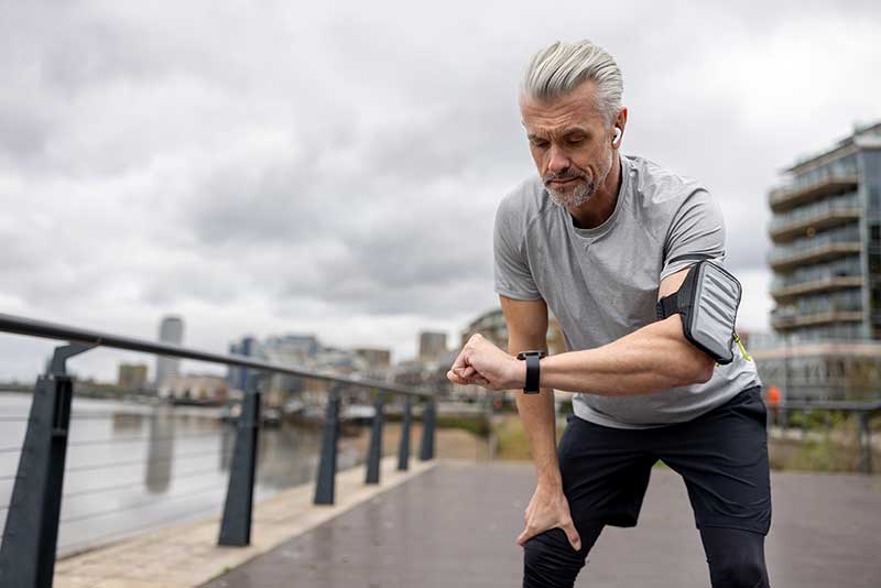 A runner looking at his watch