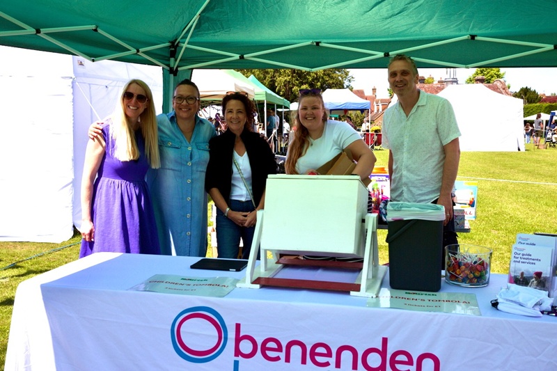A photo of a group on a village fete stand