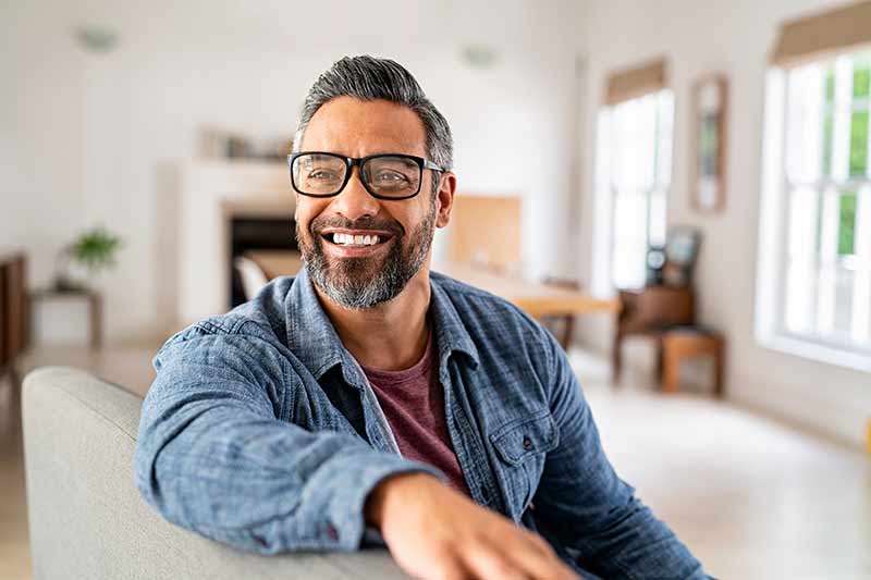 A man sitting on a sofa