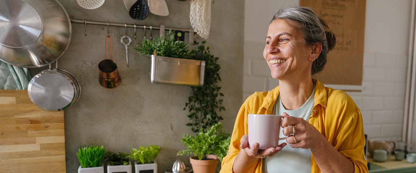 A middle aged woman in a kitchen