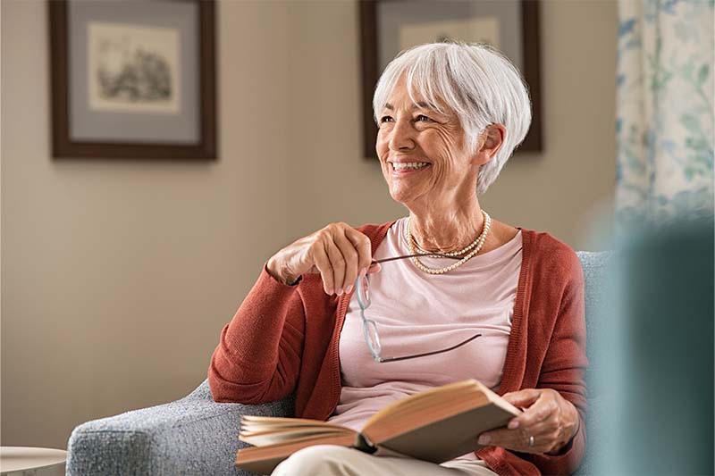 Lady reading with glasses