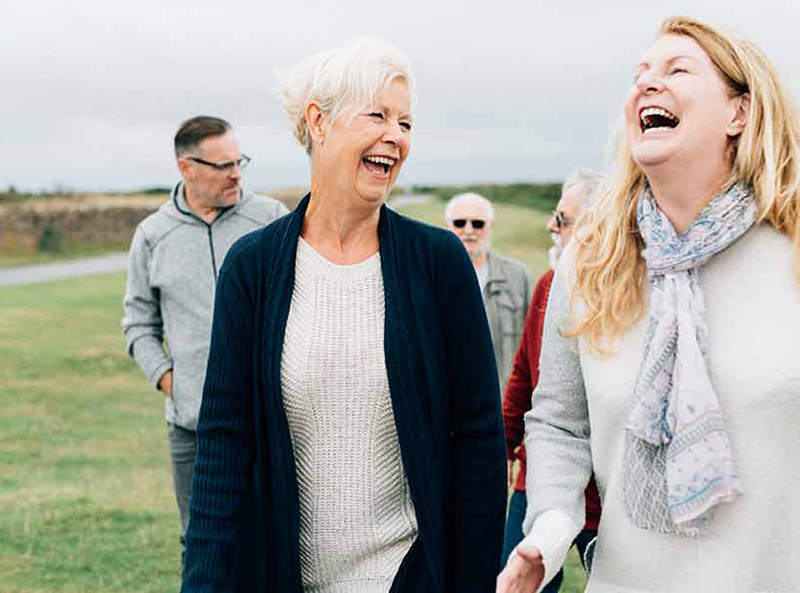 Group of friends walking and laughing